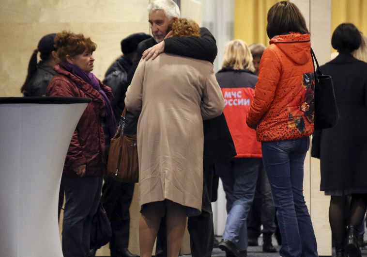 Relatives of victims of Metrojet's Airbus A-321 plane with registration number EI-ETJ that crashed in Egypt, mourn at Crowne Plaza hotel near Pulkovo airport in St. Petersburg, Russia, October 31, 2015