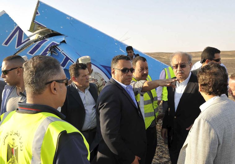 Egypt's Prime Minister Sherif Ismail (4rth R) listen to Egyptian team from police and army at the remines of a plane crash at the desert in central Sinai near El Arish city north of Egypt, October 31, 2015. The Russian airliner carrying 224 passengers crashed into a mountainous area of Egypt's Sinai