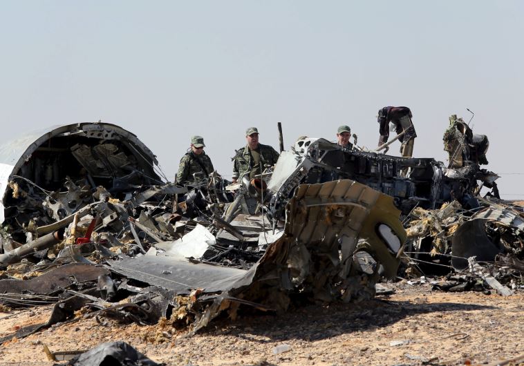 Russian airliner at its crash site at the Hassana area in Arish city, north Egypt