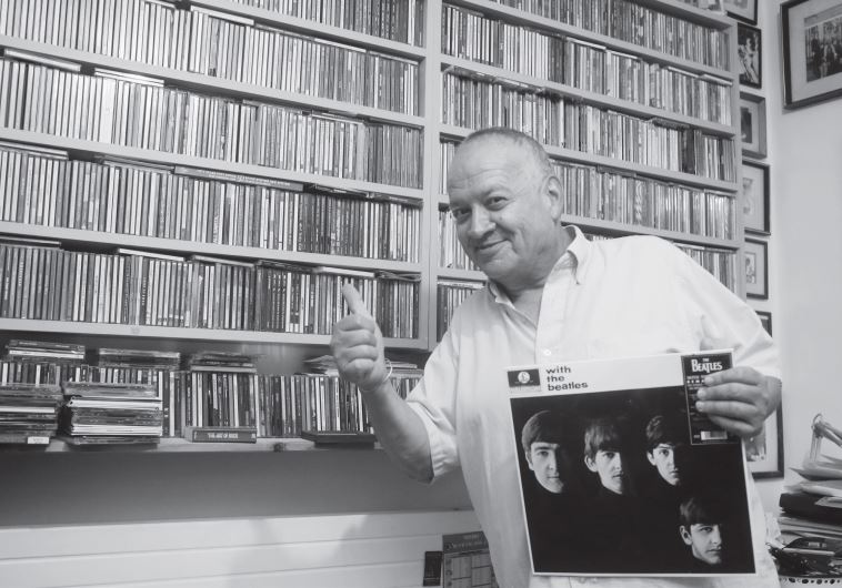 Benny Dudkevitch holds a ‘With The Beatles,’ one of his – and the country’s – first international records