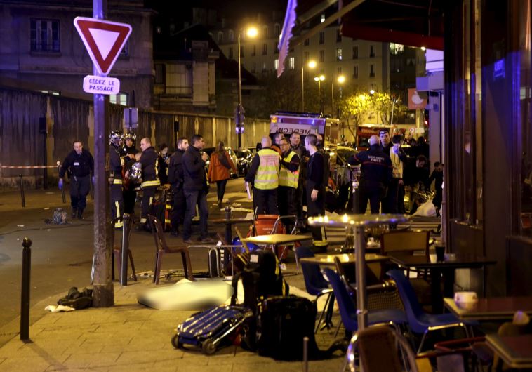 A general view of the scene that shows the covered bodies outside a restaurant following a shooting incident in Paris, France, November 13, 2015