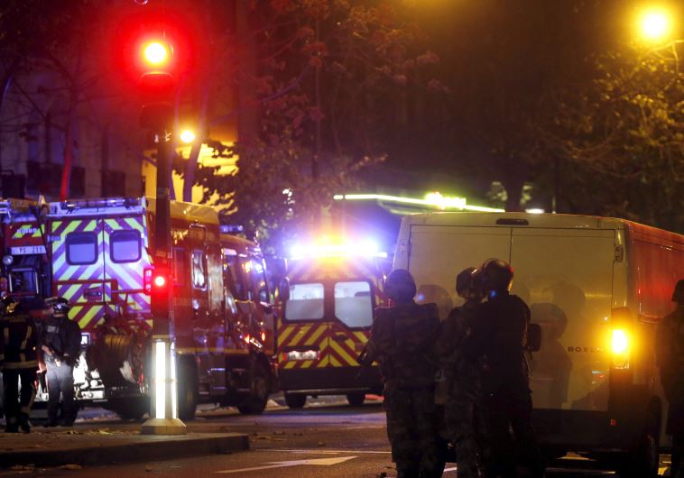 French riot police secure the area near the Bataclan concert hall following a fatal shooting at a restaurant in Paris, France, November 13, 2015