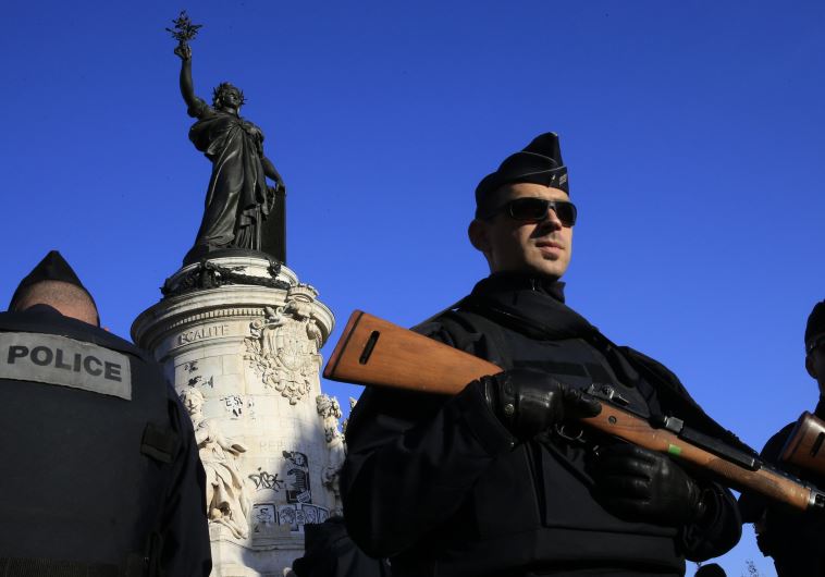 Police stand guard in Place de la Republique following the series of deadly attacks in Paris, November 15, 2015.