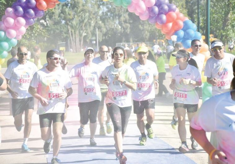 Natal volunteers take part in a 'color run' to raise money and awareness for people suffering from trauma