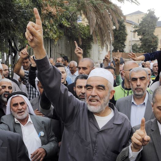 Leader of the northern Islamic Movement Sheikh Raed Salah gestures after leaving the district court in Jerusalem October 27, 2015.