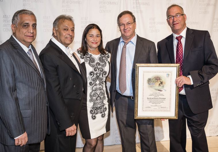  TEXAS GALA: Posing from left to right at the festive fundraiser in Dallas last week are Africa Israel’s Pini Cohen, IPO conductor Zubin Mehta, Bruria and Dudi Wiessman, and Dr. Eyran Halpern, director of the Rabin Medical Center, holding a certificate presented to him by the Weissmans
