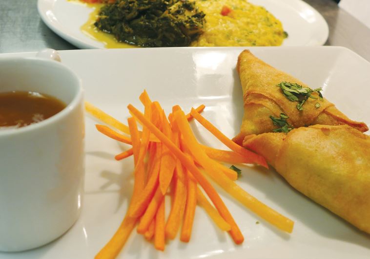 Samosas served with soup at Fifty2Fifty, a restaurant run by culinary students