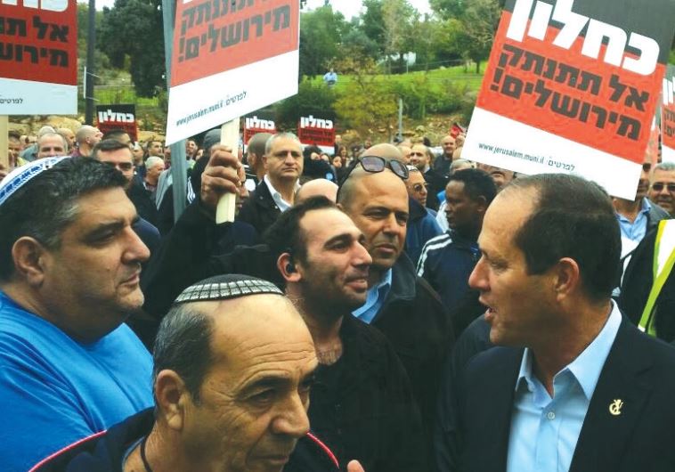 Mayor Nir Barkat leads a 2015 protest in front of the Treasury Ministry, against what he deems ‘unfair budget cuts’ by Finance Minister Moshe Kahlon