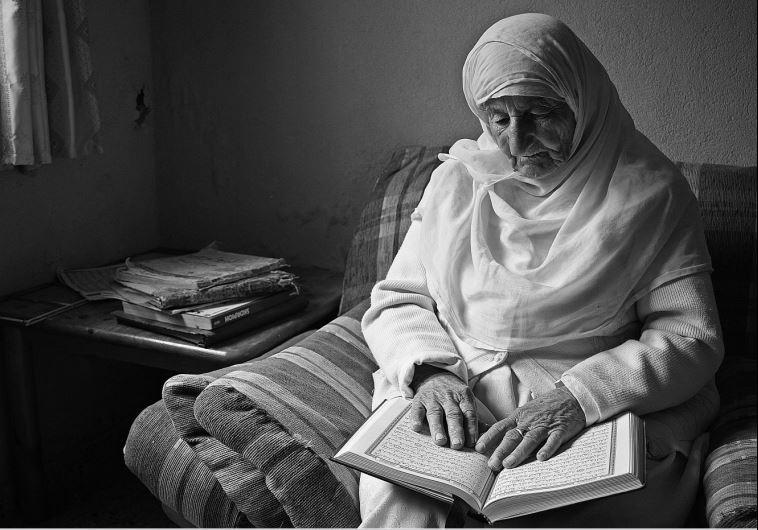 Photograph from the series ‘Brides in White’ by Amar Younis from his exhibit ‘Shadow of Time’