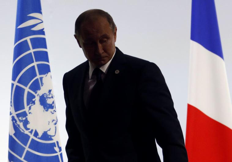 Russian President Vladimir Putin leaves after delivering a speech for the opening day of the World Climate Change Conference 2015 