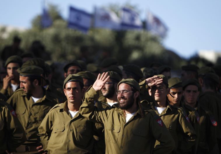 IDF soldiers of the Netzah Yehuda Haredi infantry battalion are seen during their swearing-in ceremony in Jerusalem