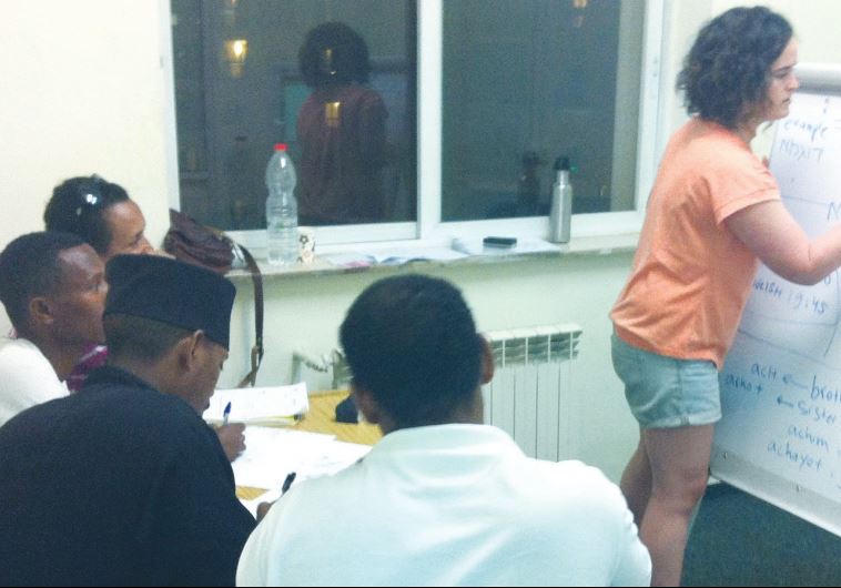 A Hebrew teacher conducts a class for asylum-seekers recently at the Jerusalem African Community Center