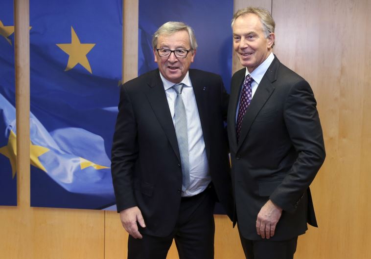 European Commission President Jean-Claude Juncker poses with Quartet Representative to the Middle East and former British Prime Minister Tony Blair (R)