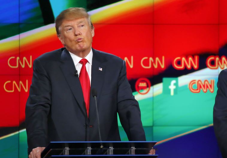 Republican US presidential candidate businessman Donald Trump reacts during the Republican presidential debate in Las Vegas, Nevada December 15, 2015.