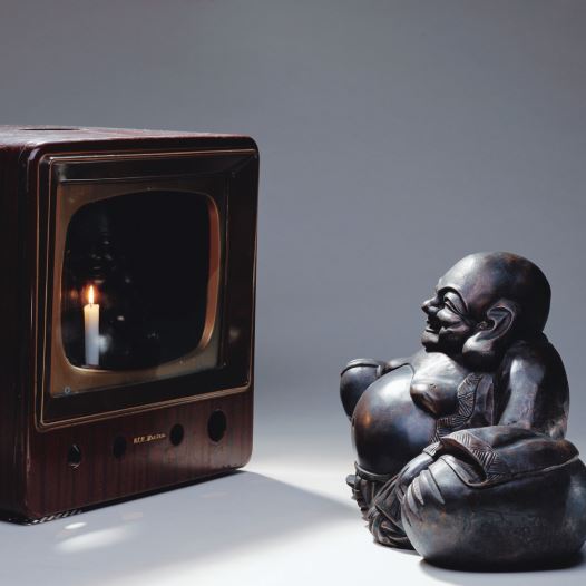 ‘Smiling Buddha (Buddha Looking at Old Candle TV),’ 1992, by Korean-American artist Nam June Paik