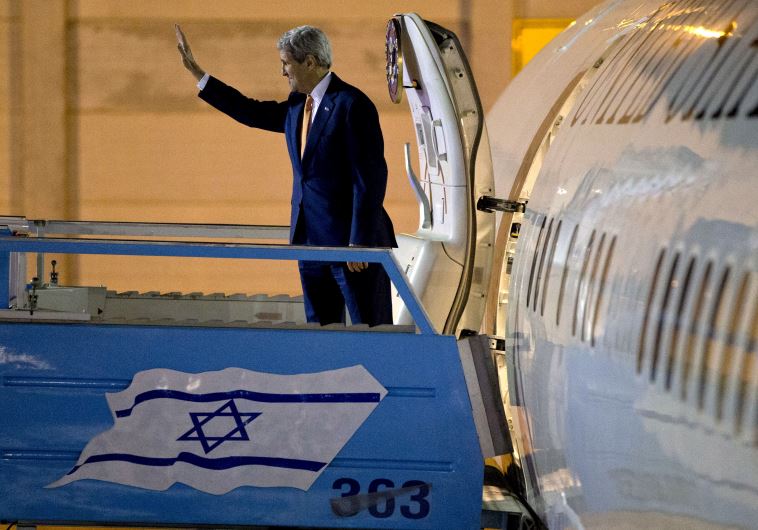 US Secretary of State John Kerry waves as he heads home after a visit to Israel and the Palestinian Authority, November 24
