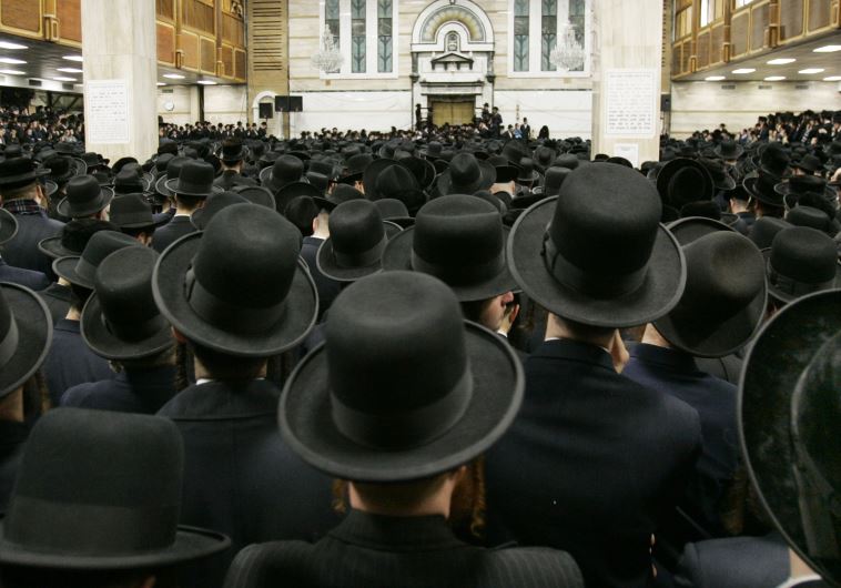 Followers of ultra-orthodox Jewish rabbi Moses Teitelbaum of the Satmar Hassidim pack the Congregation Yetev Lev D'Satmar in the town of Kirays Joel, New York