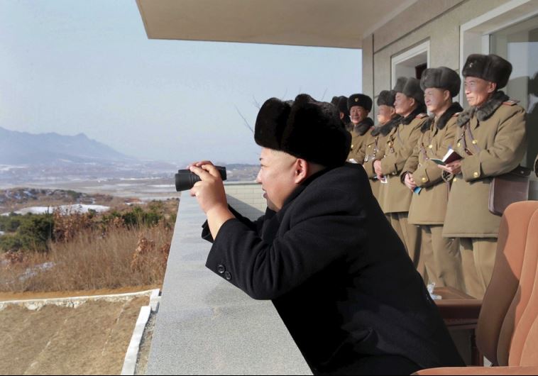 North Korean leader Kim Jong Un watches maneuvers between KPA large combined units 526 and 671 at undisclosed location in   this undated photo released by North Korea's Korean Central News Agency