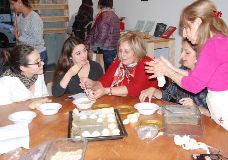 Baking cookies with the women of the Rameh Orthodox Christian Church.