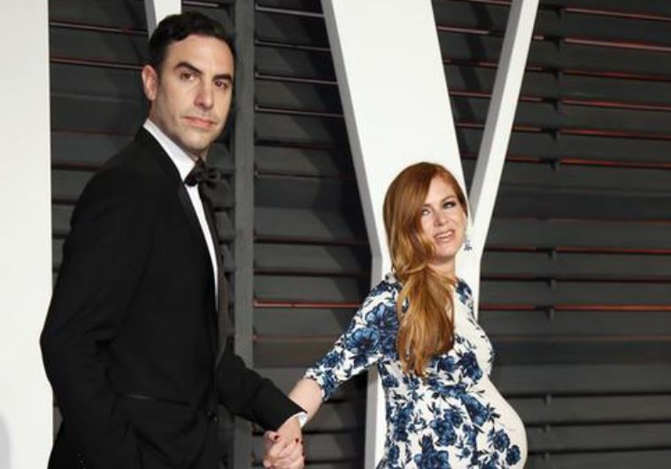 Actors Sasha Baron Cohen and Isla Fisher arrive at the 2015 Vanity Fair Oscar Party in Beverly Hills, California February 22, 2015. 