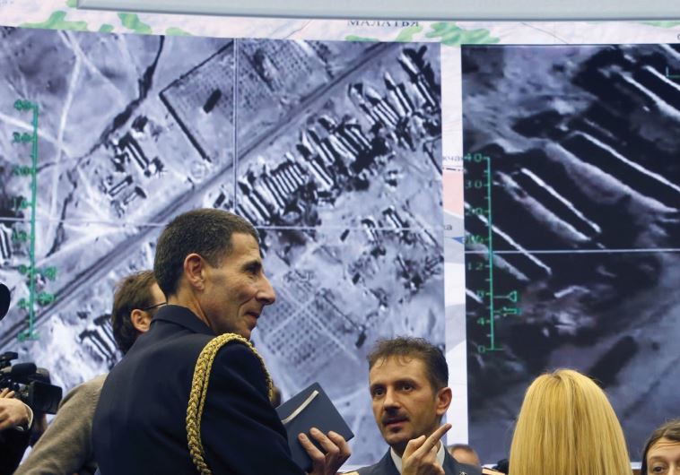 MILITARY ATTACHES and journalists talk after a Russian Defense Ministry briefing in Moscow about the attempt to interdict Islamic State’s oil trade.