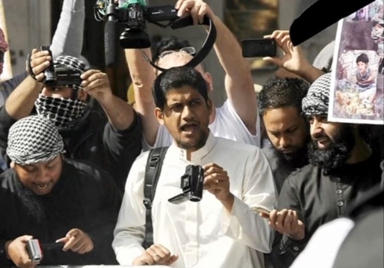 A file photograph shows a man identified by British media as Siddharta Dhar taking part in a demonstration outside the US embassy in London