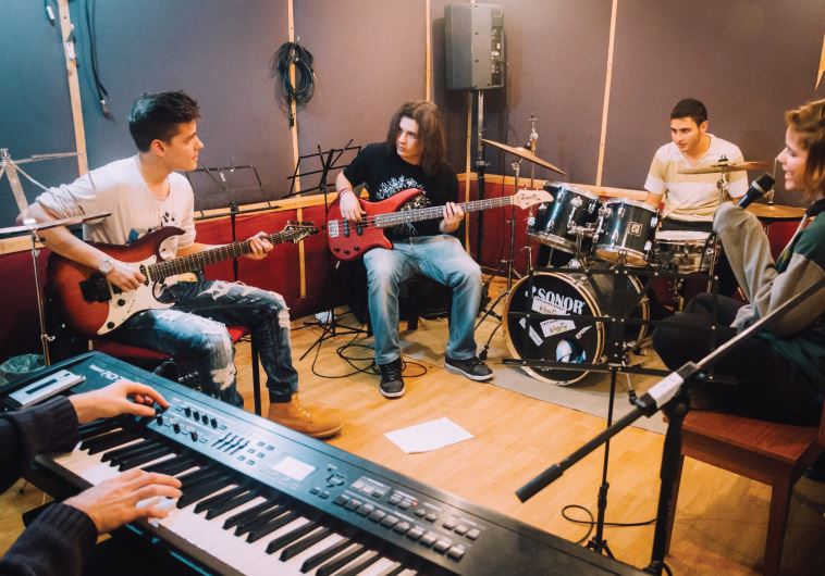 ASPIRING MUSICIANS of all ages rehearse and learn at Lenagen Bekef music school in Jerusalem.