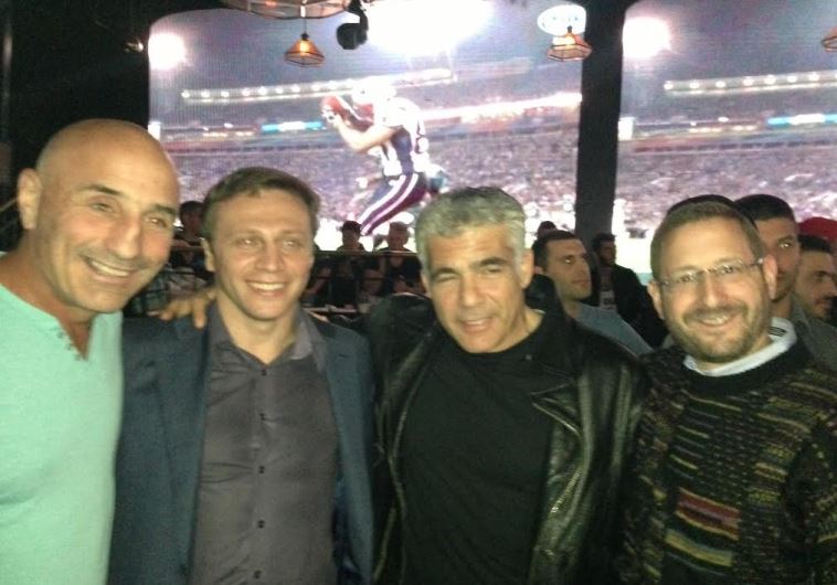 Lapid with Yesh Atid lawmakers at 2015 Super Bowl party