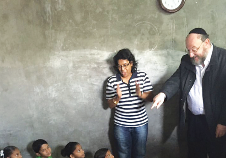 UK CHIEF RABBI Ephraim Mirvis teaches a Gabriel Projectsponsored class to children in Mumbai during his 11-day trip to India this past week.
