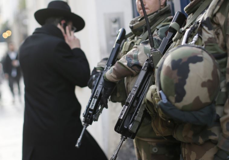French soldiers patrol the street in a Jewish neighborhood 
