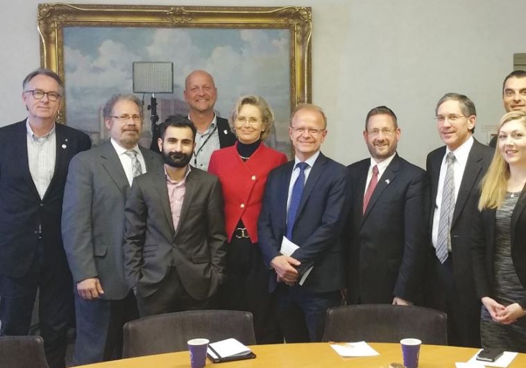 SWEDISH PARLIAMENTARIAN Margareta Cederfeldt (fifth from left) poses with, to her right, fellow MP Mikael Oscarsson, WZO director of public diplomacy Dov Lipman, Palestinian Media Watch’s Itamar Marcus and other opposition lawmakers yesterday in Stockholm