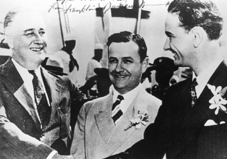 exas Gov. Allred (center) with President Franklin D. Roosevelt  and Representative Lyndon B. Johnson in Galveston, Texas, on May 12, 1937.