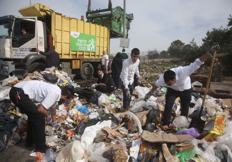 Sanitation workers and residents sort through masses of rubbish for a diamond ring that was accidentally tossed in the garbage, Jerusalem, January 21, 201