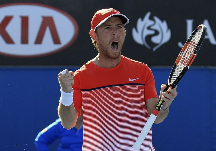 Israel's Dudi Sela celebrates after winning his second round match against Spain's Fernando Verdasco at the Australian Open tennis tournament at Melbourne Park, Australia, January 21, 2016.