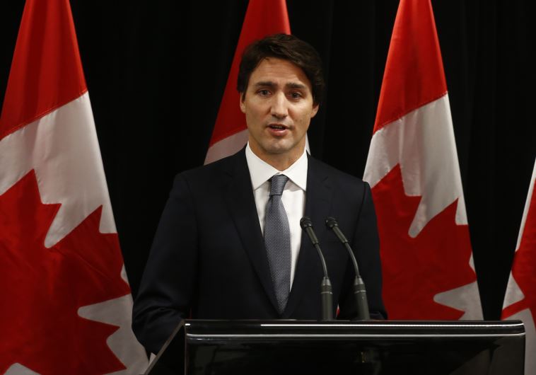 Canadian Prime Minister Justin Trudeau speaks about a Saskatchewan school shooting during a news conference in Davos, January 22, 2016. 