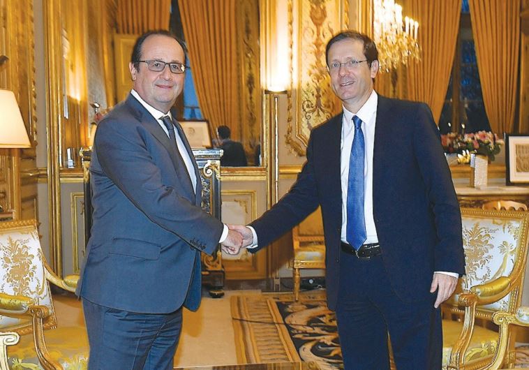 FRENCH PRESIDENT François Hollande welcomes opposition leader MK Isaac Herzog to Paris on Friday.