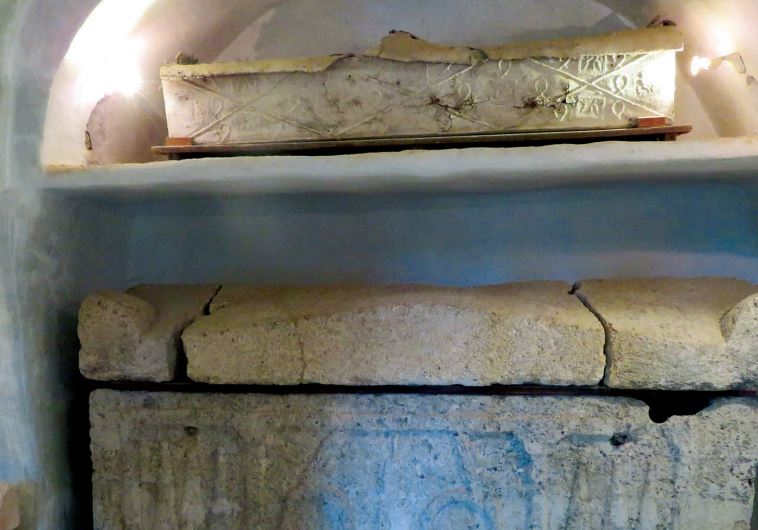 An ancient burial cave in the moshav’s biblical gardens