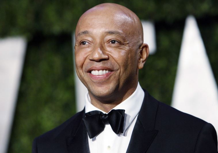 Def Jam co-founder Russell Simmons arrives at the 2010 Vanity Fair Oscar party