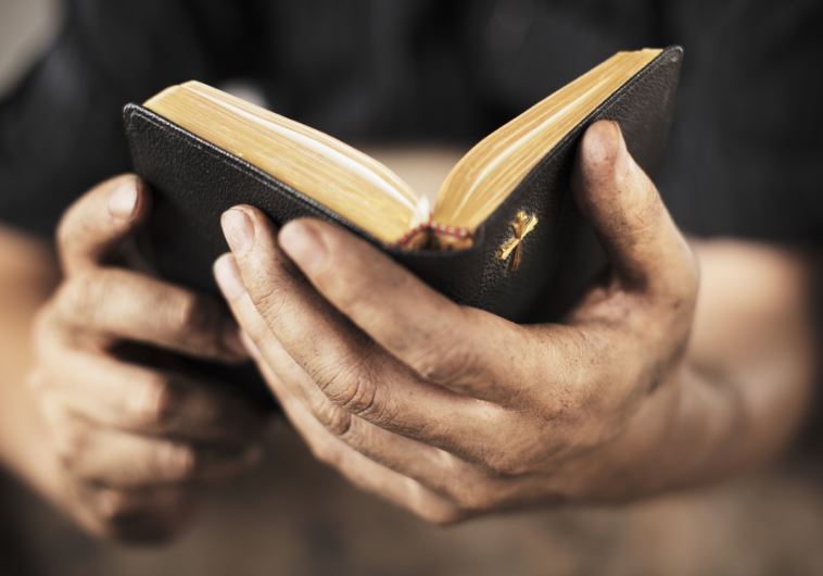 Man holding a bible