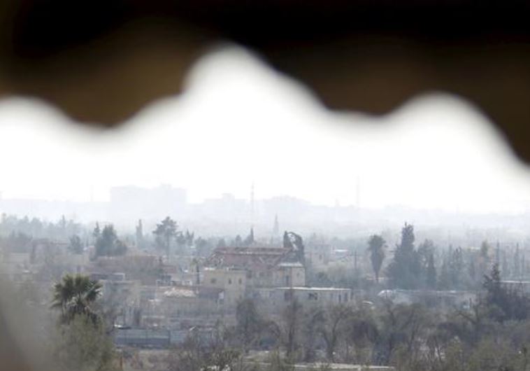 A general view shows the besieged city of Douma from Wafideen Camp, which is controlled by Syrian government forces, in Damascus suburbs, Syria February 13, 2016. 