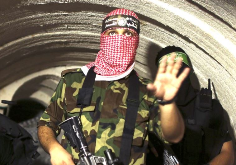 A gunman from the Izz ad-Din al- Qassam Brigades, the armed wing of Hamas, photographed inside an underground tunnel in Gaza, in 2014.