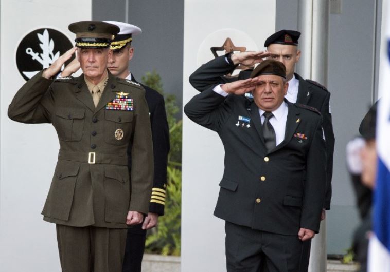 IDF chief of staff Gadi Eizenkot (R) and US Chairman of the Joint Chiefs of Staff, General Joseph F. Dunford (L), salute their national anthems during an official ceremony in Tel Aviv