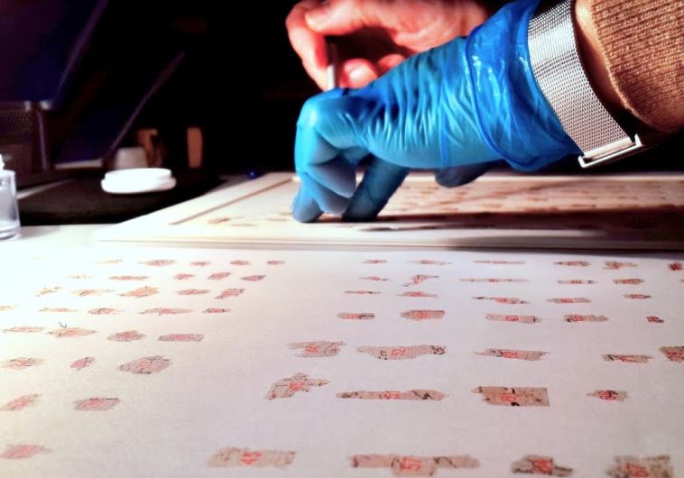 ANTIQUITIES AUTHORITY researchers utilize advanced technology to piece together thousands of fragments from the Dead Sea Scrolls. 