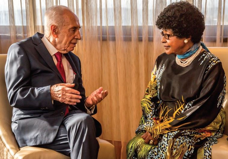 Former president Shimon Peres meets with former South African first lady Winnie Madikizela-Mandela in Johannesburg, February 28, 2016