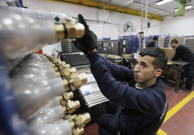 A Palestinian employee works at the SodaStream factory [File]