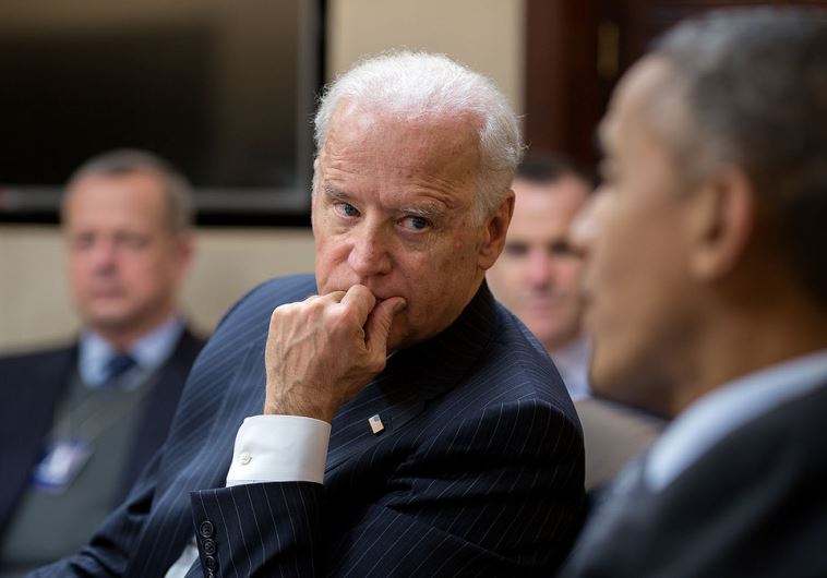 Vice President Joe Biden listens to President Barack Obama in the White House