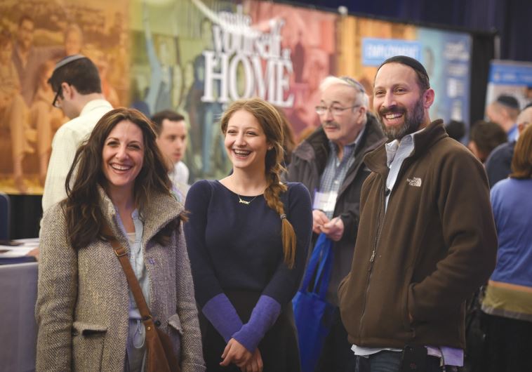 RACHEL (LEFT), ABBY and Bentzion Raice attend the aliya fair in New York Sunday