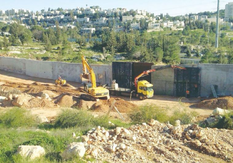 CONSTRUCTION VEHICLES prepare a housing site in the capital’s Ramat Shlomo neighborhood last week.