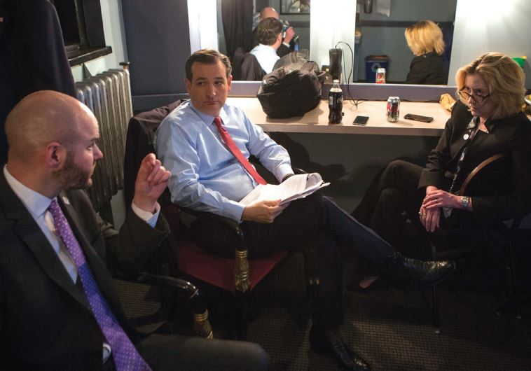 GOP CANDIDATE Ted Cruz meets with his national security adviser Victoria Coates and chief political strategist Jason Johnson prior to last week’s debate in Detroit