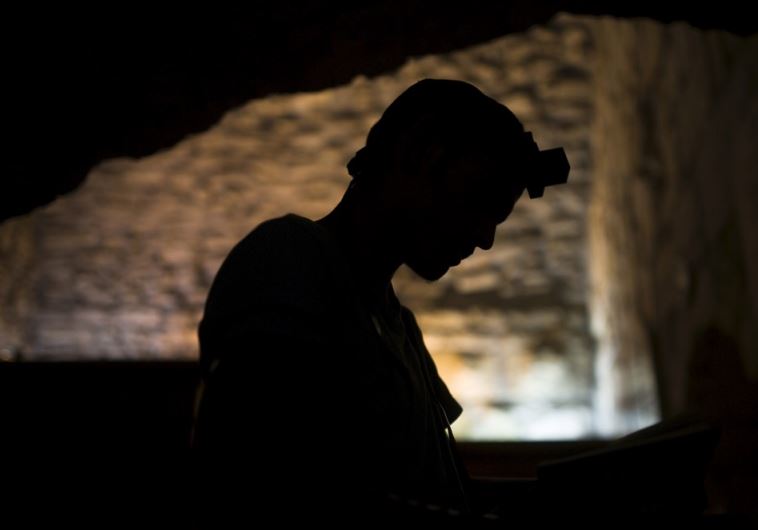 A Jewish worshipper prays at the Western Wall in Jerusalem's Old City